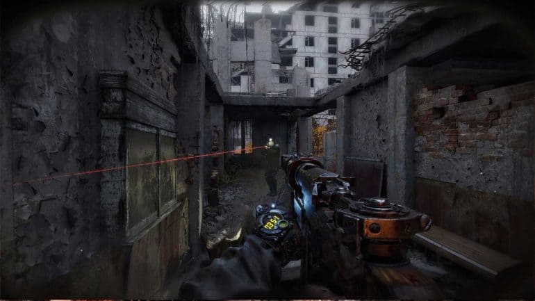First-person shooter game scene with laser targeting in a ruined city.